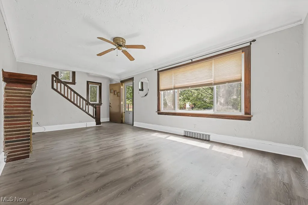 Living room with stairs leading to the second floor