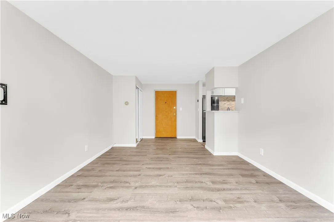 Empty room featuring light wood-type flooring