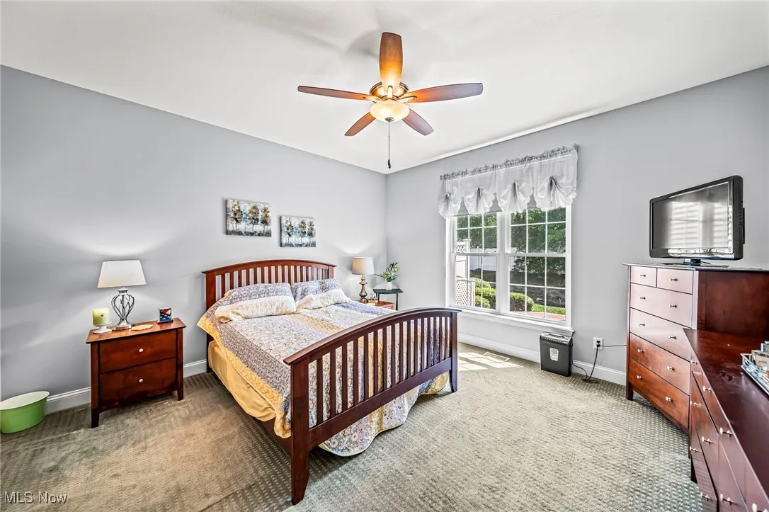 Bedroom featuring carpet flooring and ceiling fan