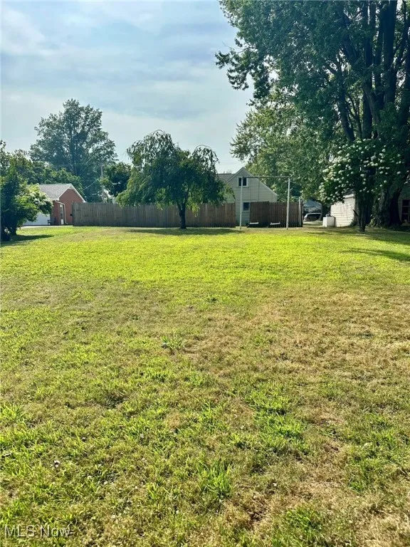 Fenced backyard featuring a patio and outdoor dining area