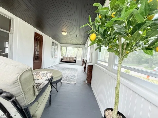 Sunroom / solarium with wood finished floors