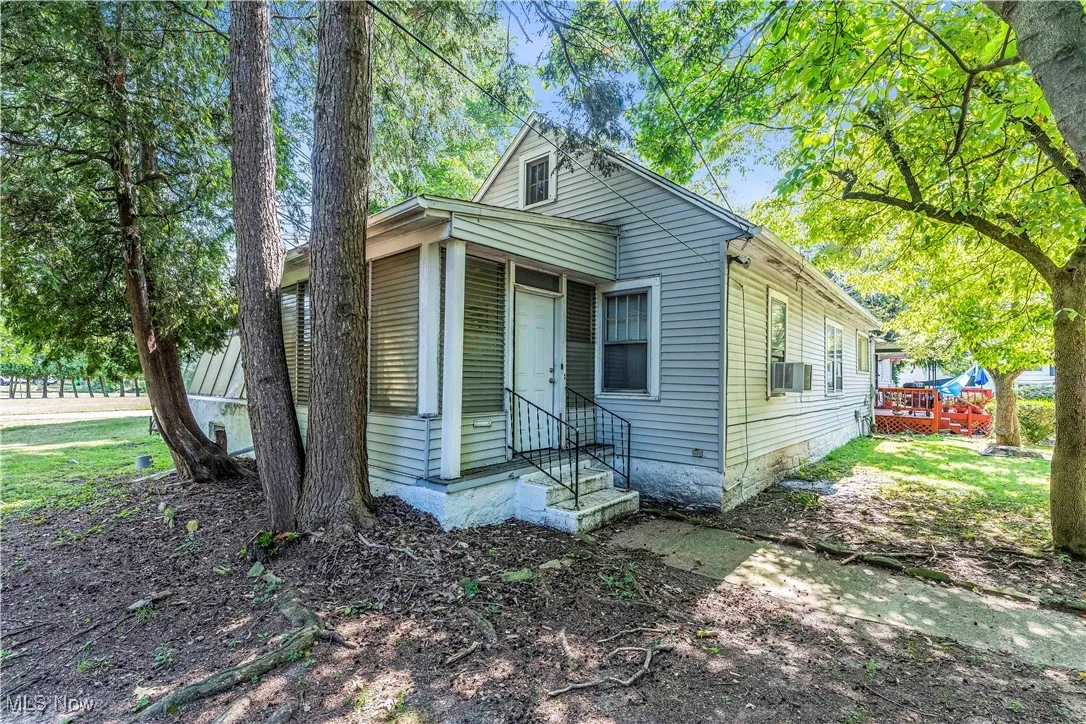 View of front of property with crawl space and a deck