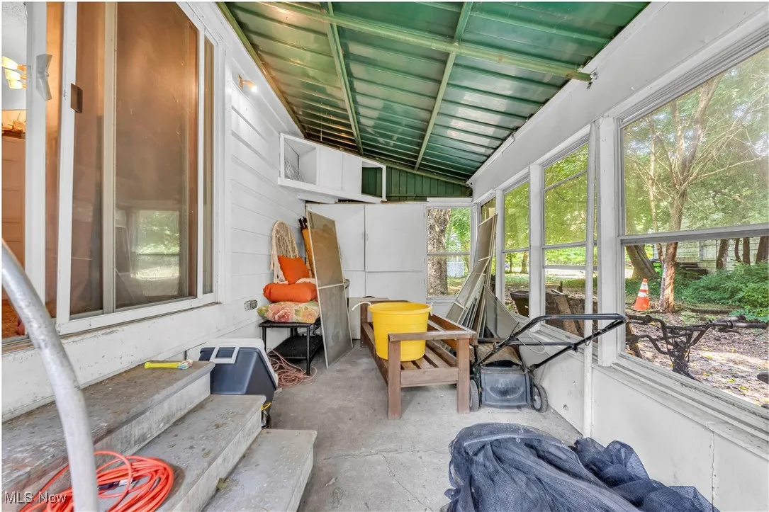 Sunroom featuring lofted ceiling and entry​​‌​​​​‌​​‌‌​‌‌​​​‌‌​‌​‌​‌​​​‌​​ steps