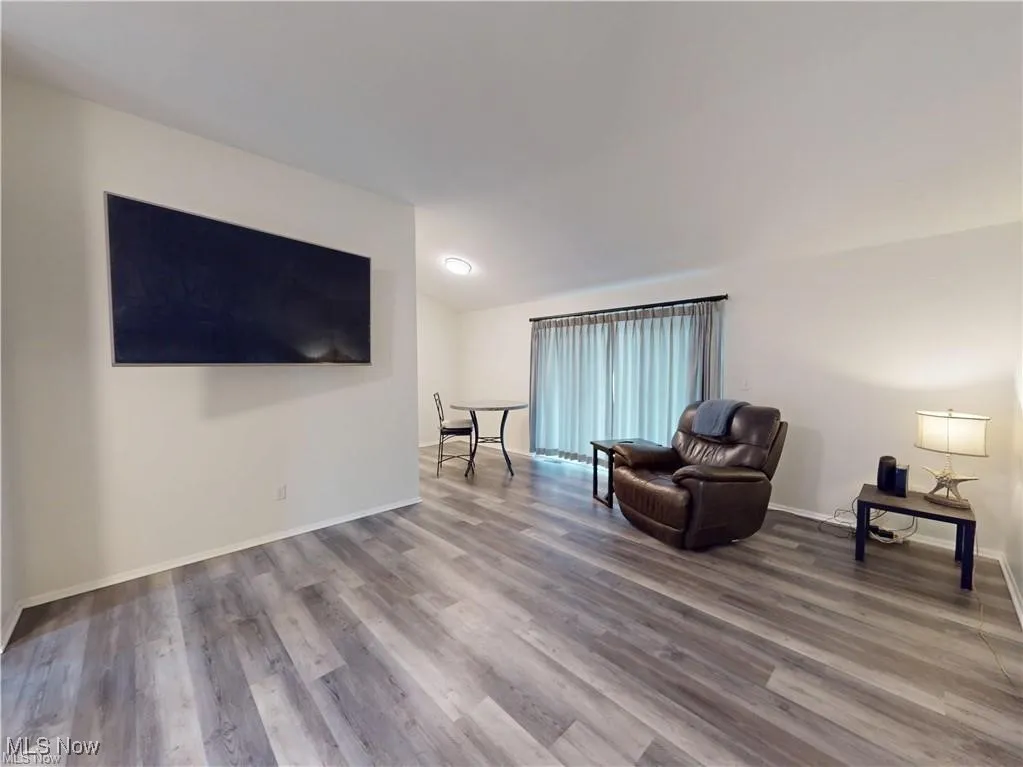 Living room with wood finished floors and baseboards
