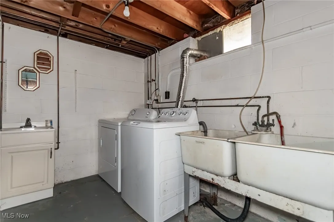 Laundry room with washing machine and clothes dryer