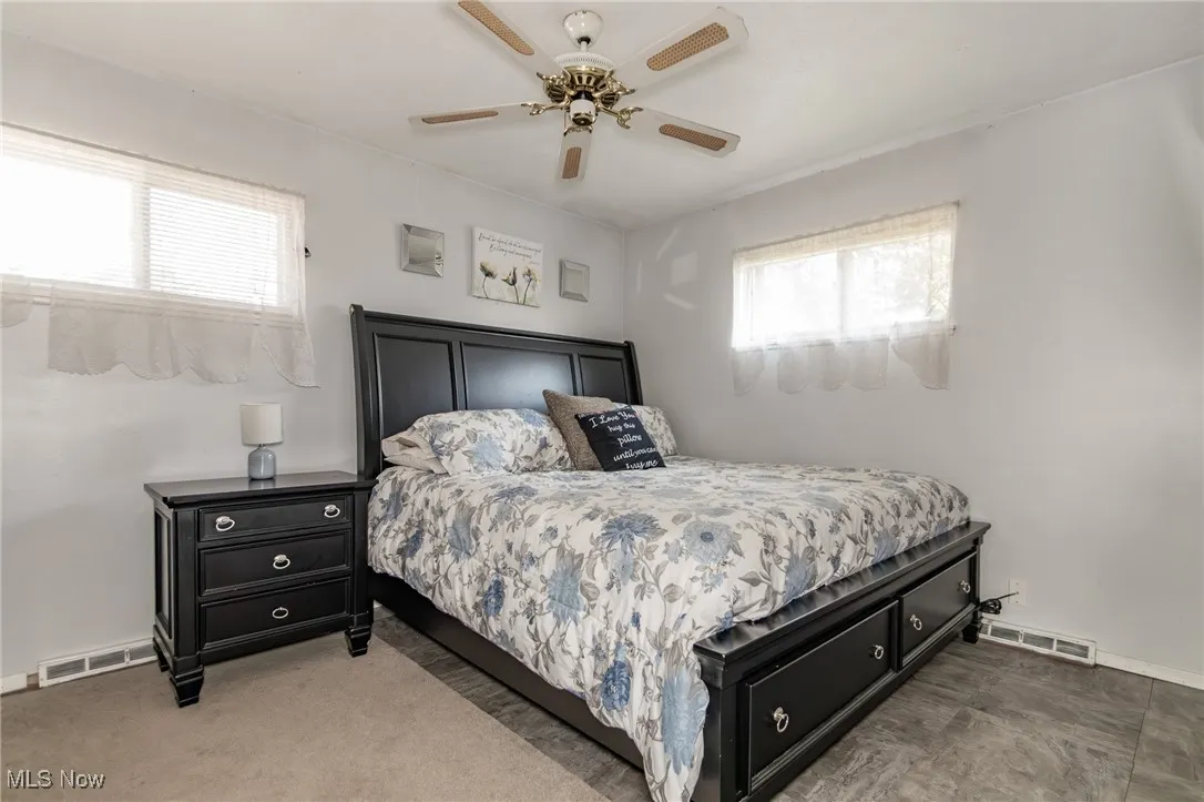 Bedroom with baseboards and a ceiling fan