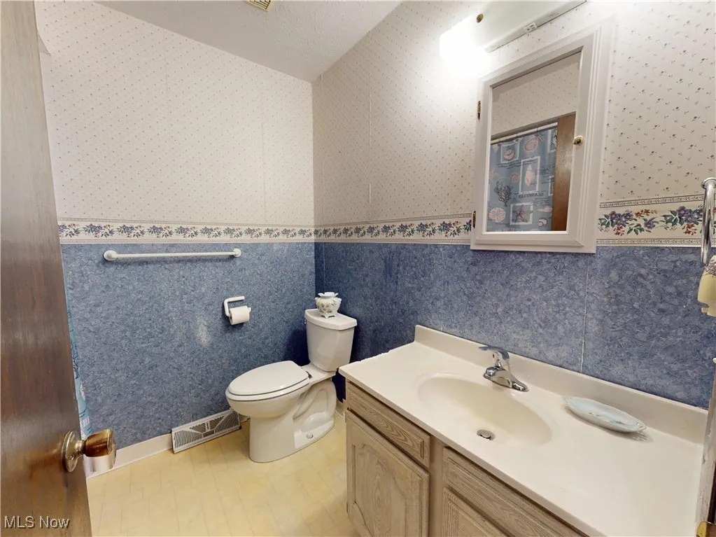 Bathroom featuring vanity and a shower with curtain