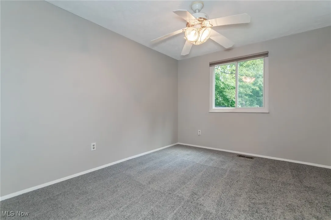 Bedroom featuring carpet flooring and a ceiling fan