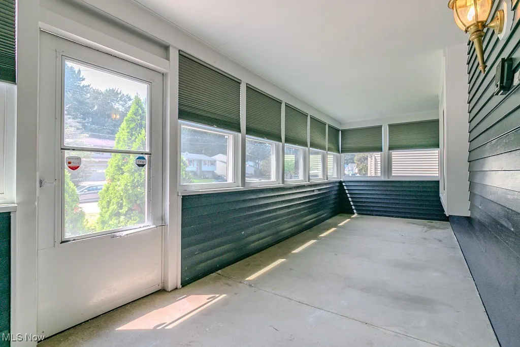 Front house entrance, enclosed sunroom.
