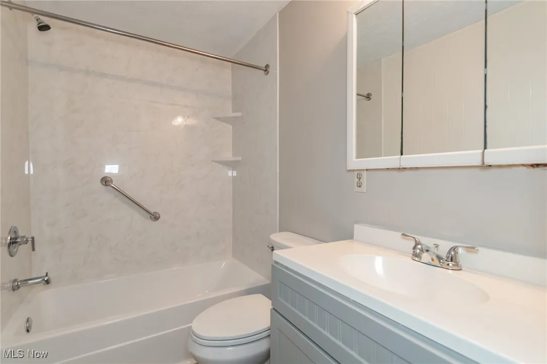 Full bath with shower / bathtub combination and vanity