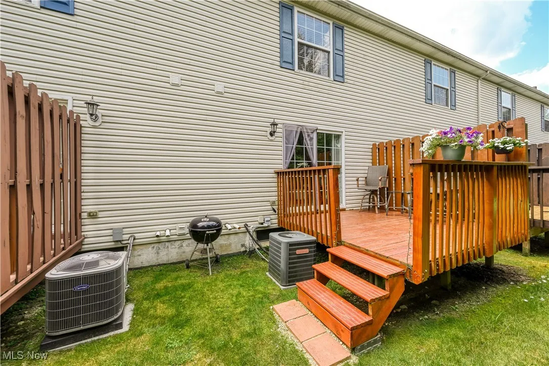 Rear view of property with a wooden deck