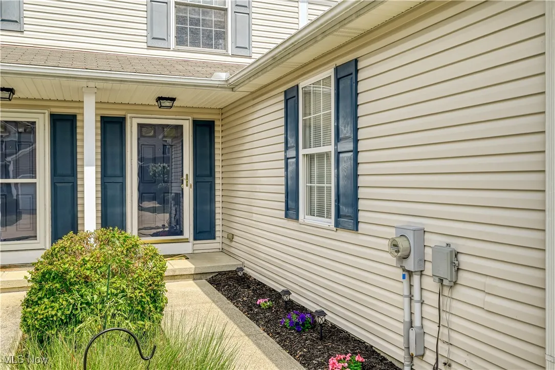 Entrance to property featuring a porch