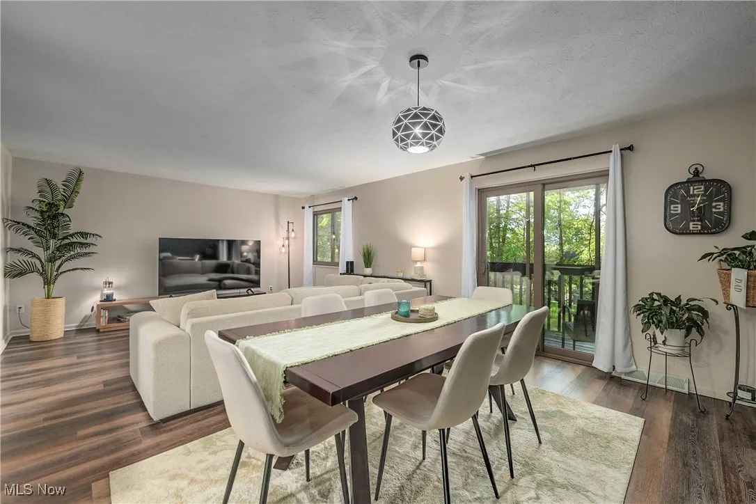 Dining room featuring dark wood-type flooring