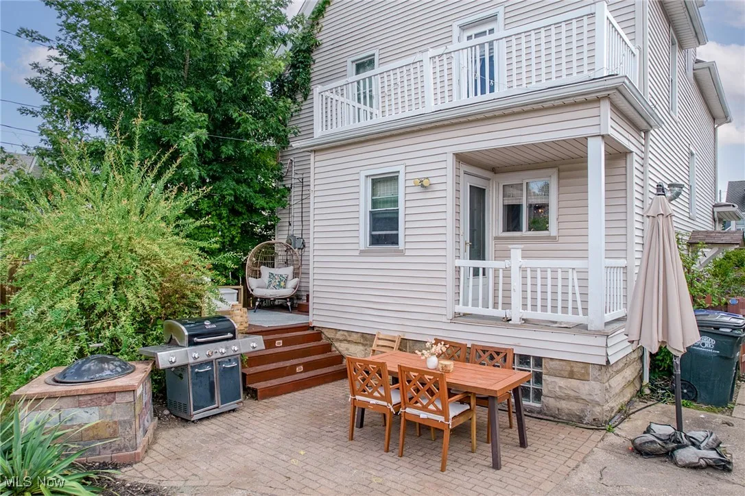 Patio / terrace with outdoor dining area, a patio, a grill, and a wooden deck