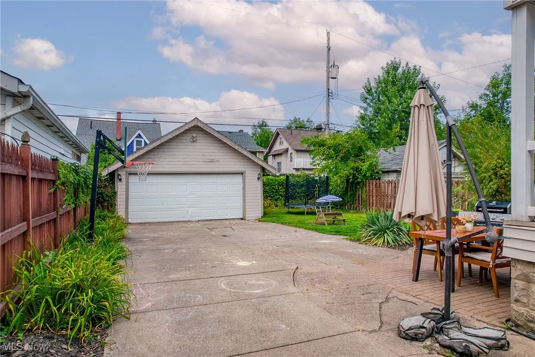 Detached garage featuring a trampoline