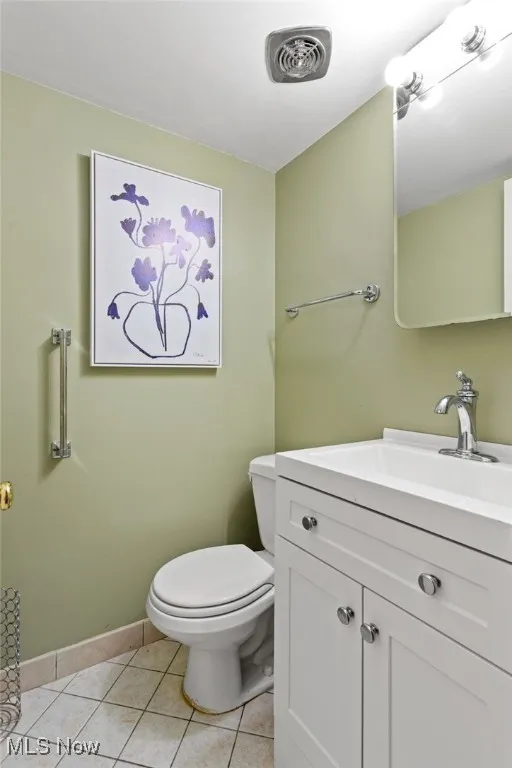 Bathroom featuring vanity and light tile patterned floors