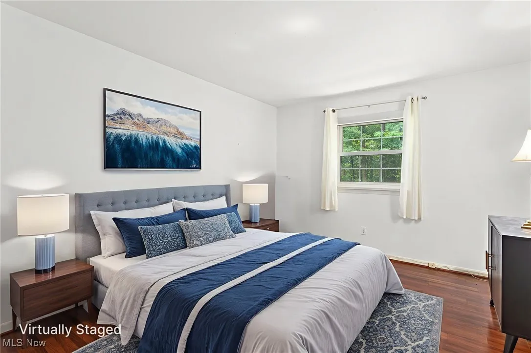 virtually staged Bedroom with laminate floors
