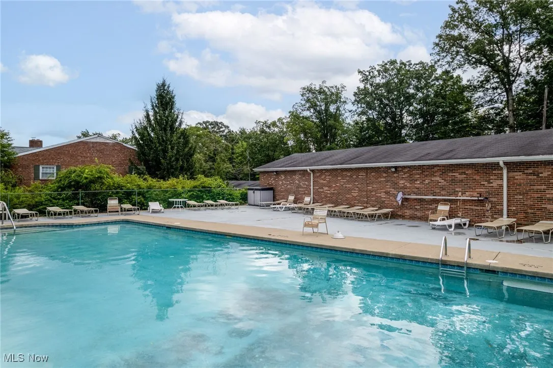 Community pool featuring a patio area