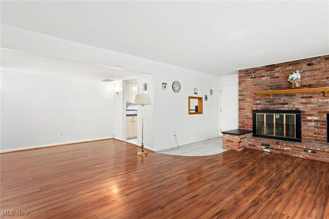 Unfurnished living room featuring laminate flooring