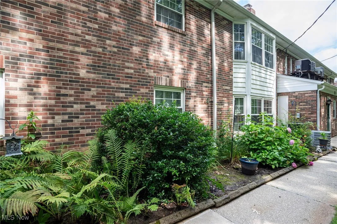 View of home's exterior with brick siding and a central air condition unit
