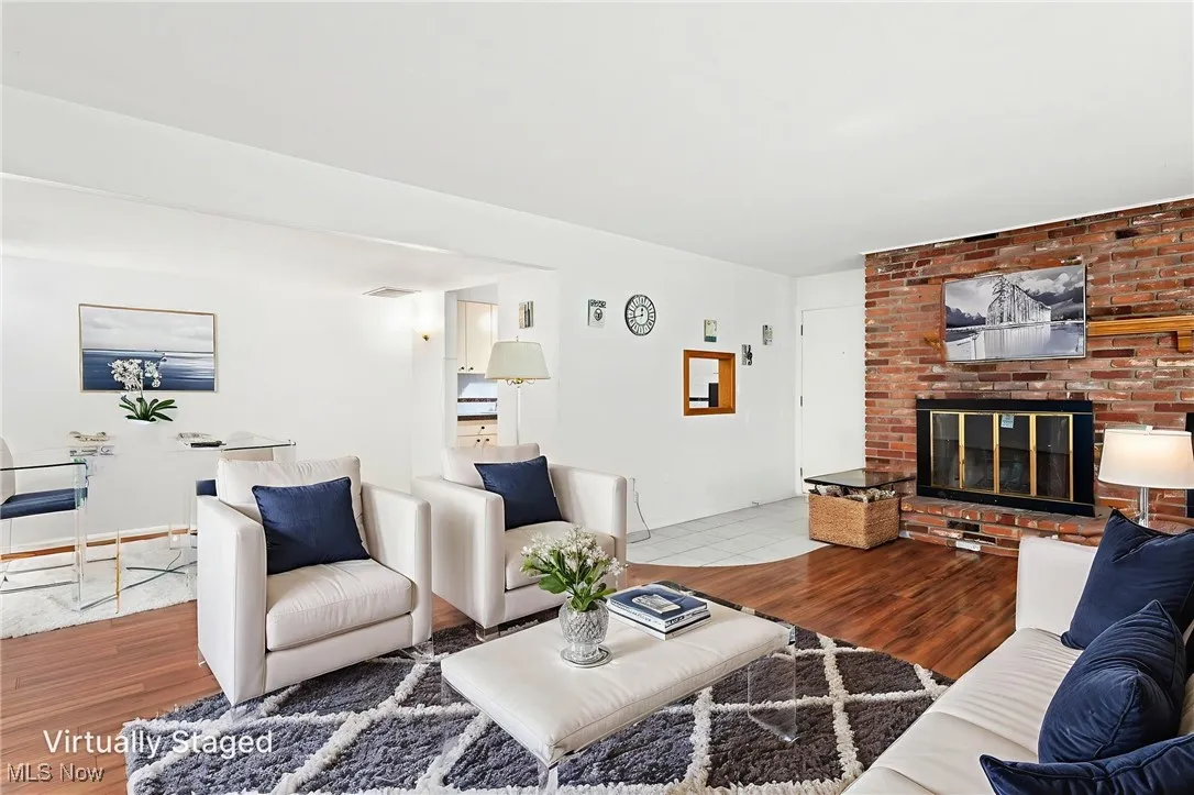 Virtually staged Living room featuring laminate flooring