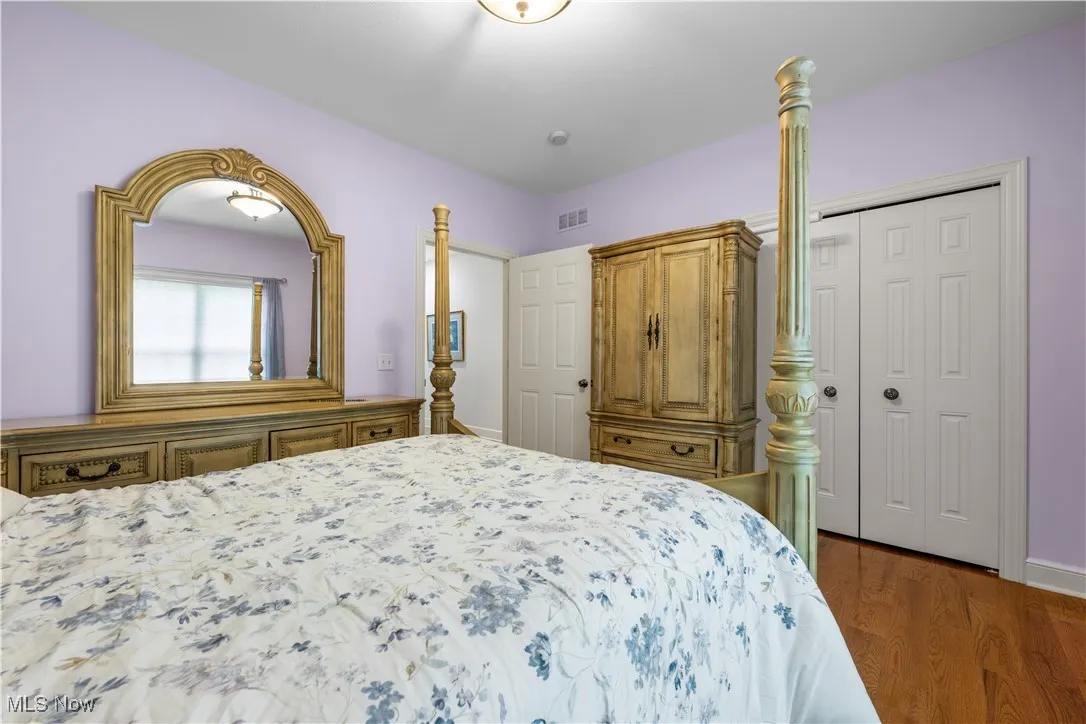 Bedroom featuring a closet and wood finished floors