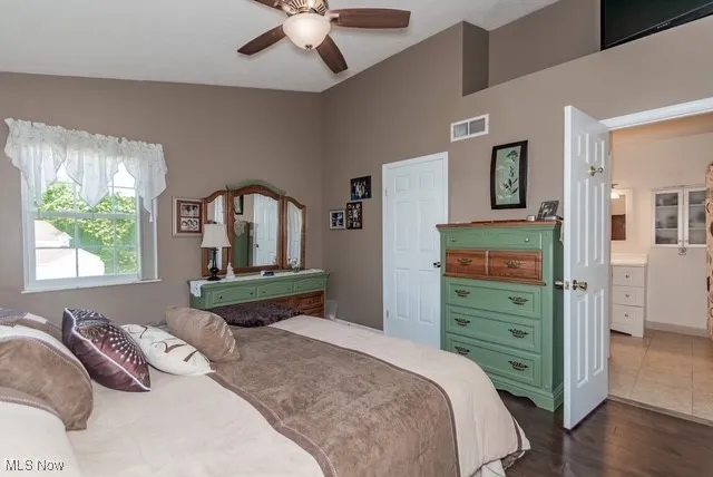Bedroom featuring dark wood-type flooring and ceiling fan