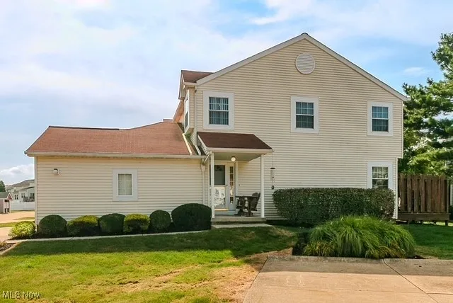 Front of home with yard.