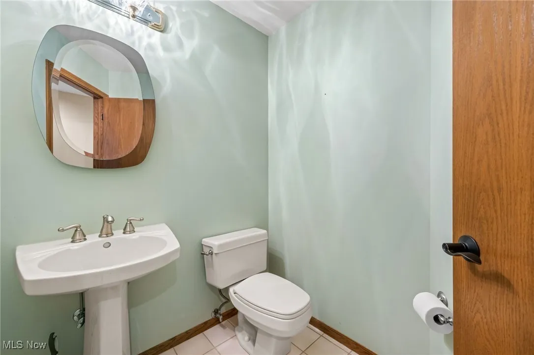 Bathroom featuring tile patterned flooring and toilet