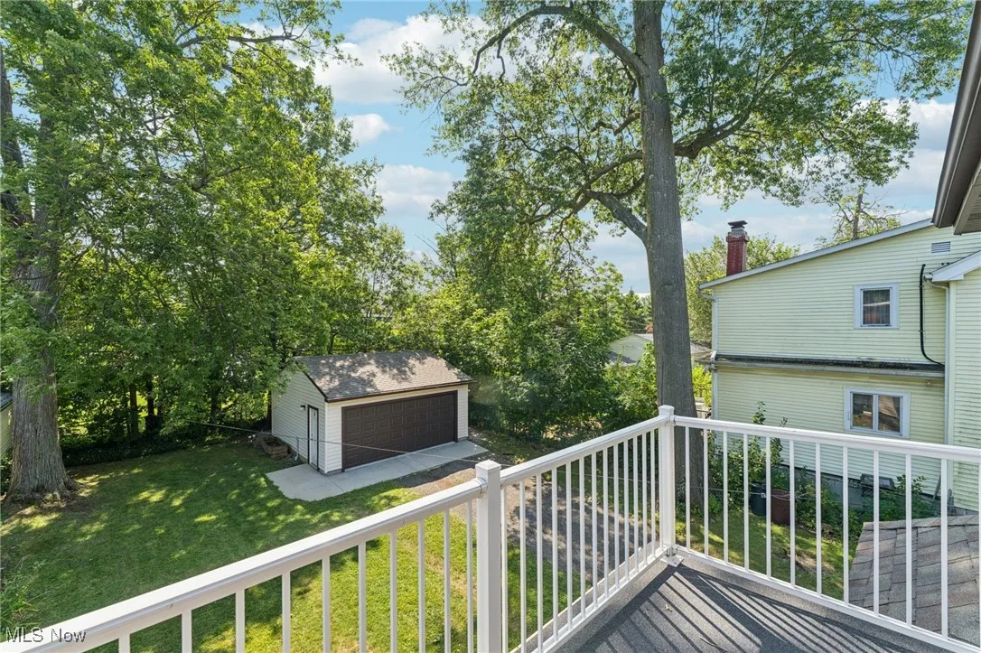 Balcony with view of wooded area