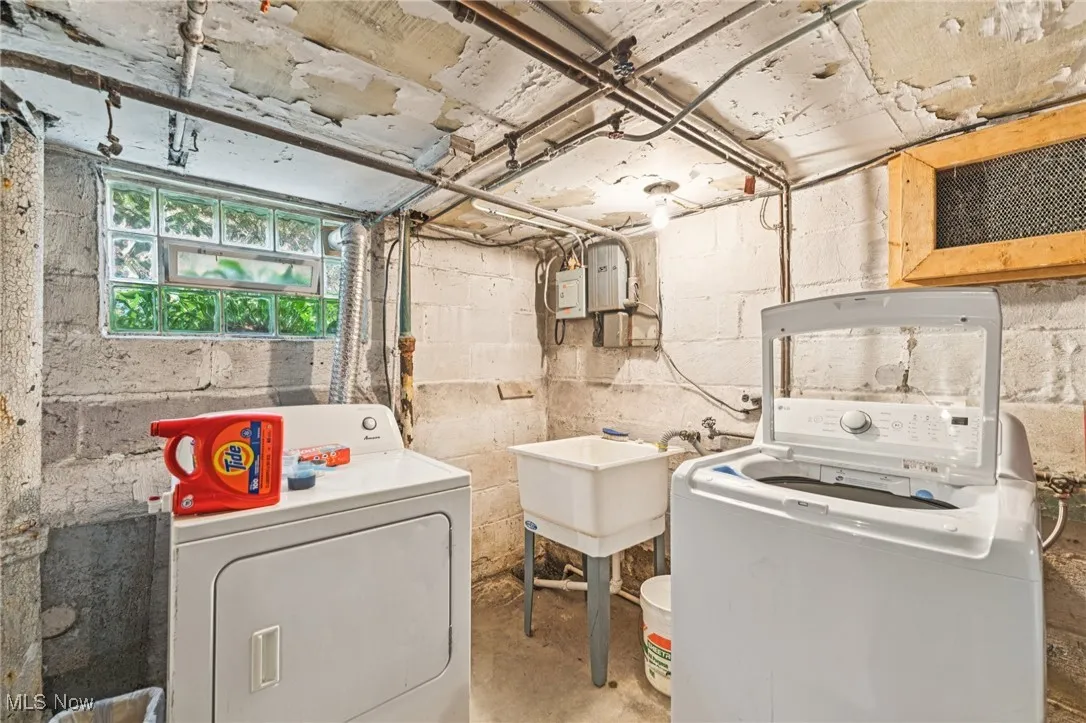 Laundry room featuring separate washer and dryer