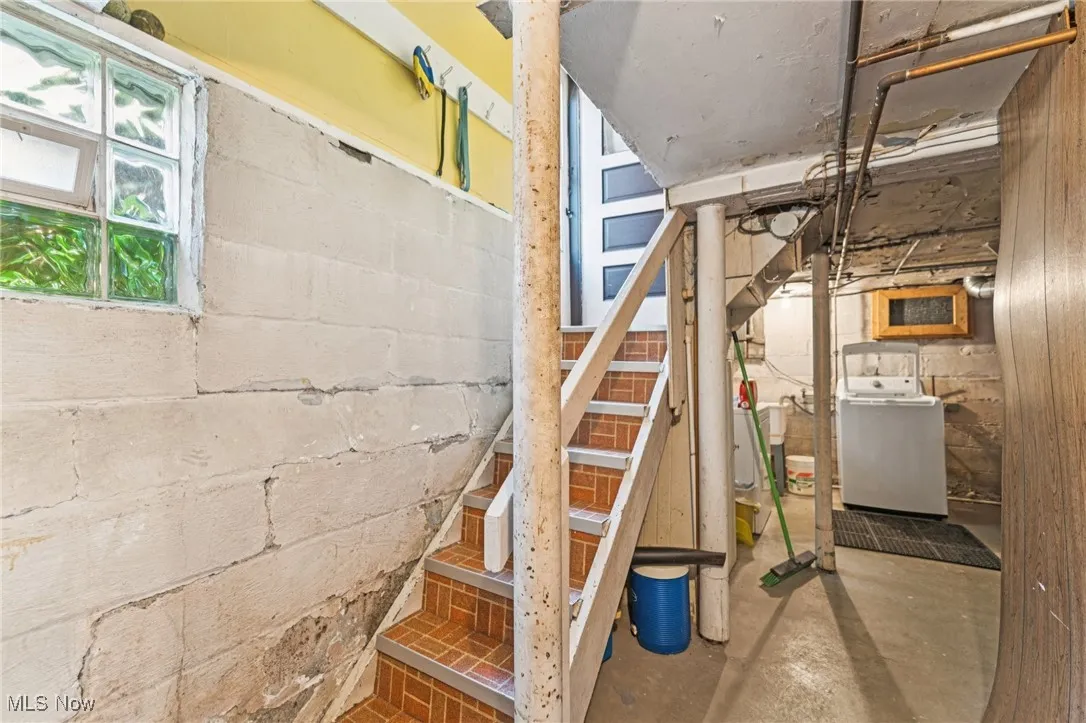 Below grade area with washer / dryer