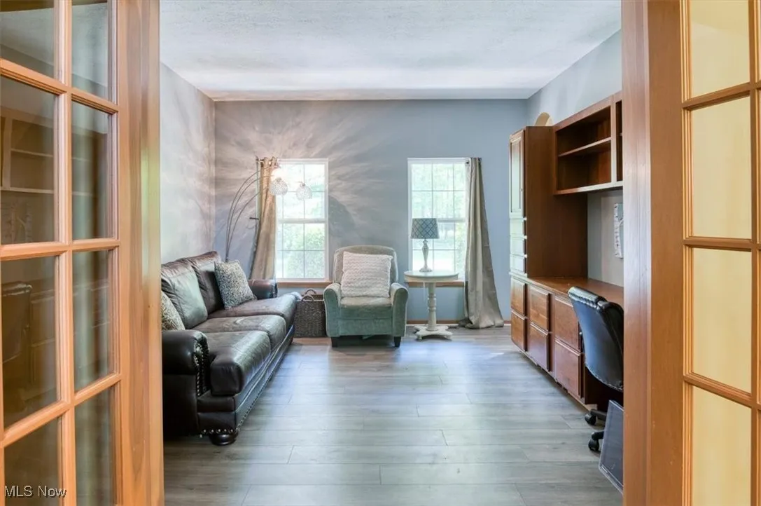 Living area featuring an office area and light wood-style floors