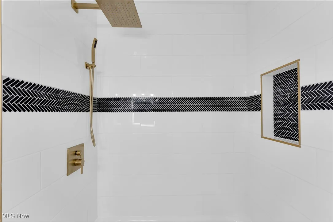 Bathroom view of a tile shower
