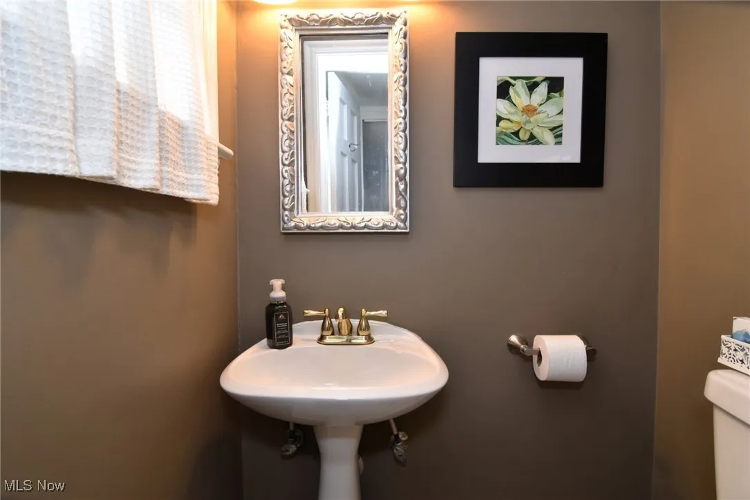 Half bathroom featuring toilet