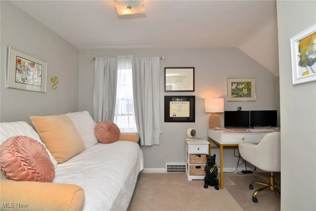 Carpeted office featuring baseboards