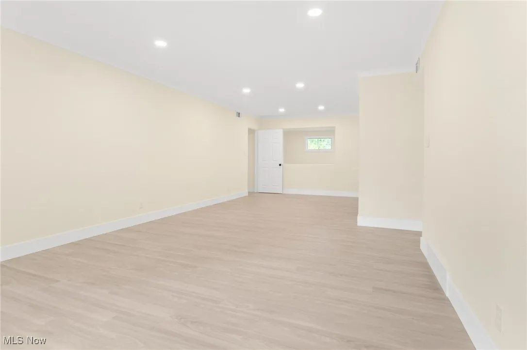 Spare room with recessed lighting and light wood-style flooring