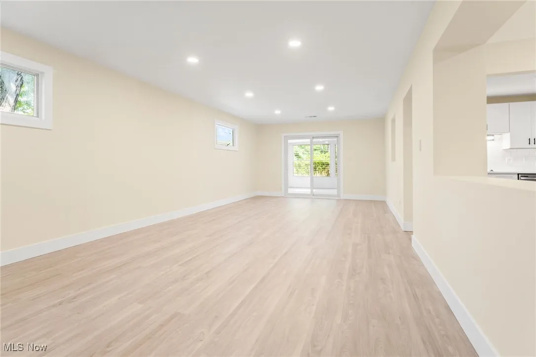 Unfurnished living room with recessed lighting and light wood-style flooring