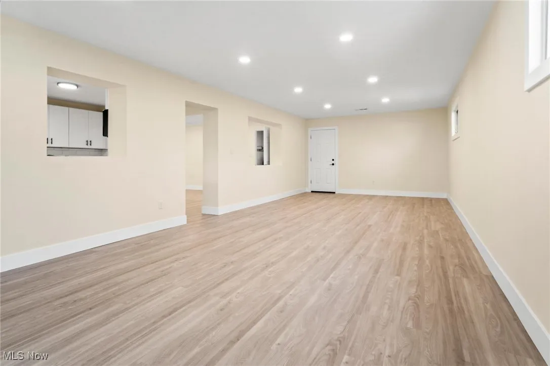 Unfurnished living room with recessed lighting and light wood finished floors