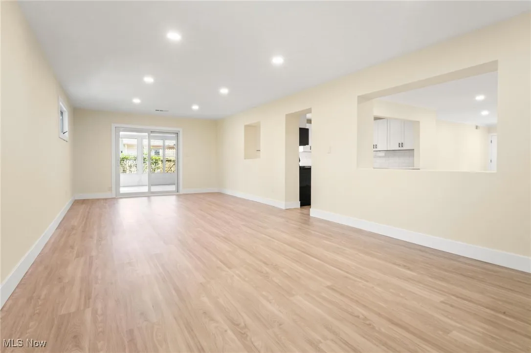 Unfurnished living room with recessed lighting and light wood finished floors