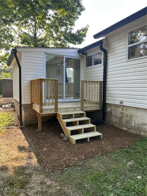 Wooden terrace featuring stairs