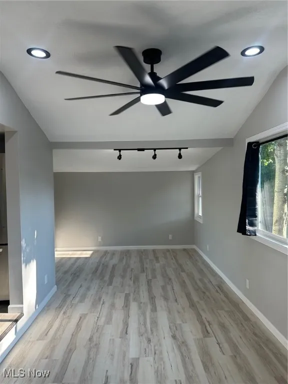 Main living room with slider to small deck and steps to yard