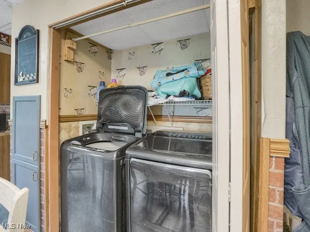 Washroom featuring separate washer and dryer