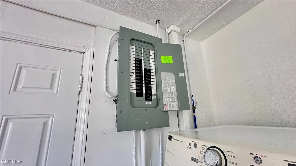 Utilities with electric panel and washer / dryer
