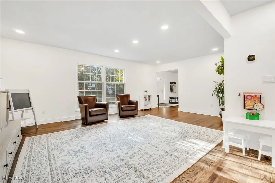 Living area with recessed lighting and wood finished floors