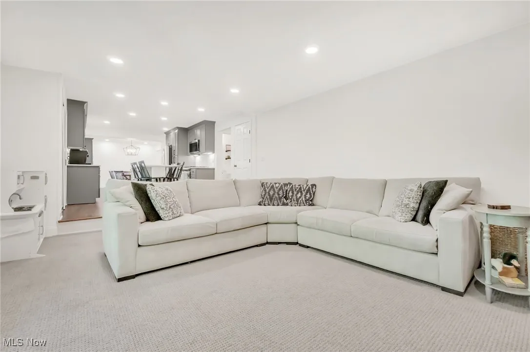 Living room featuring carpet and recessed lighting
