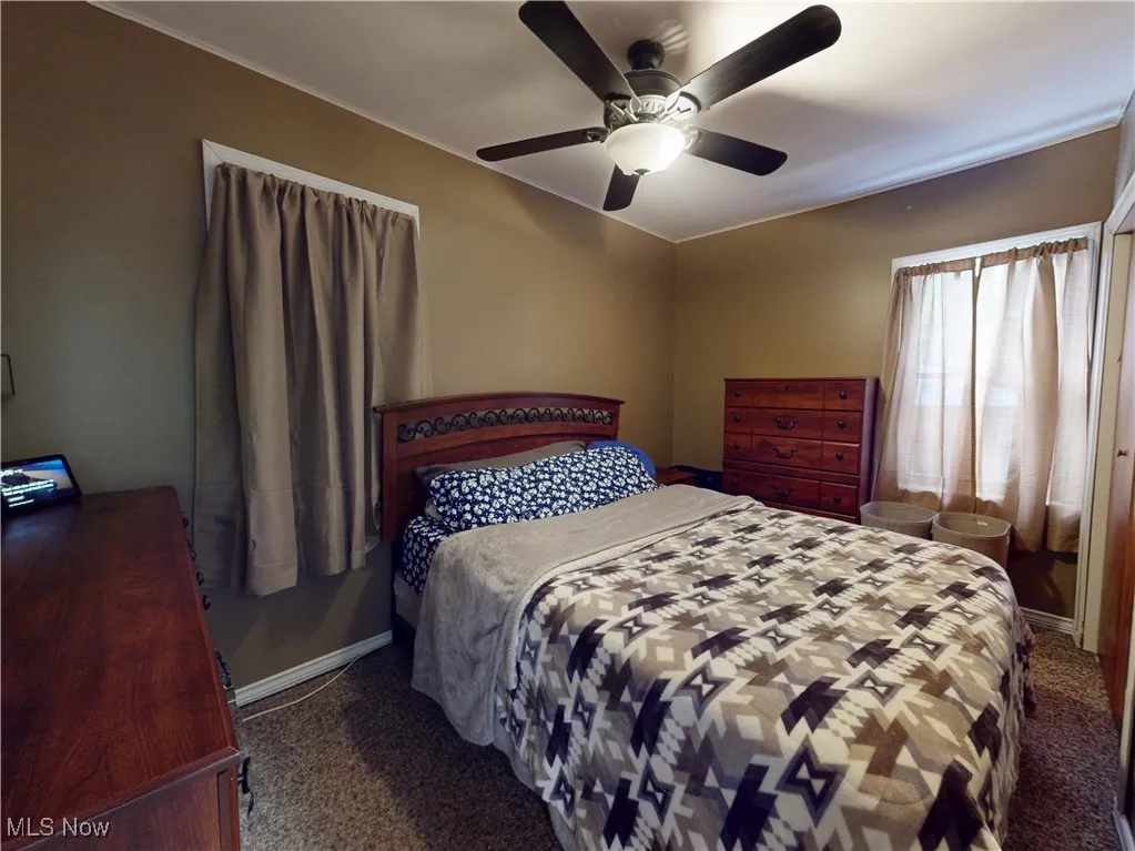 Bedroom featuring carpet flooring and ceiling fan