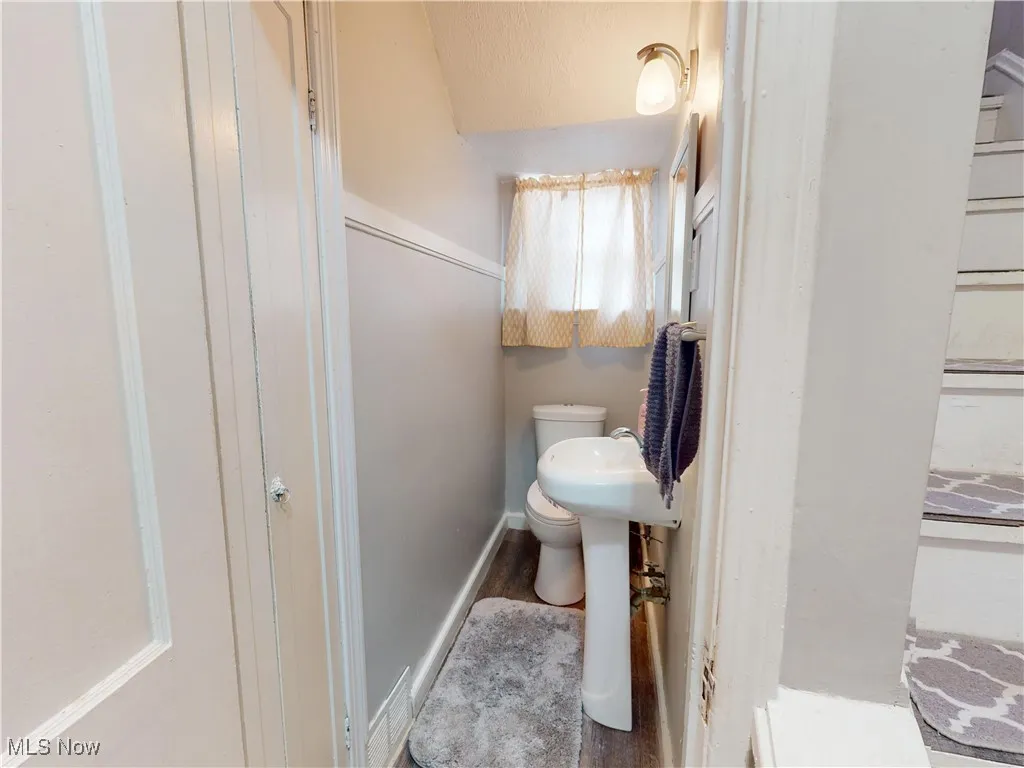Bathroom with baseboards and toilet