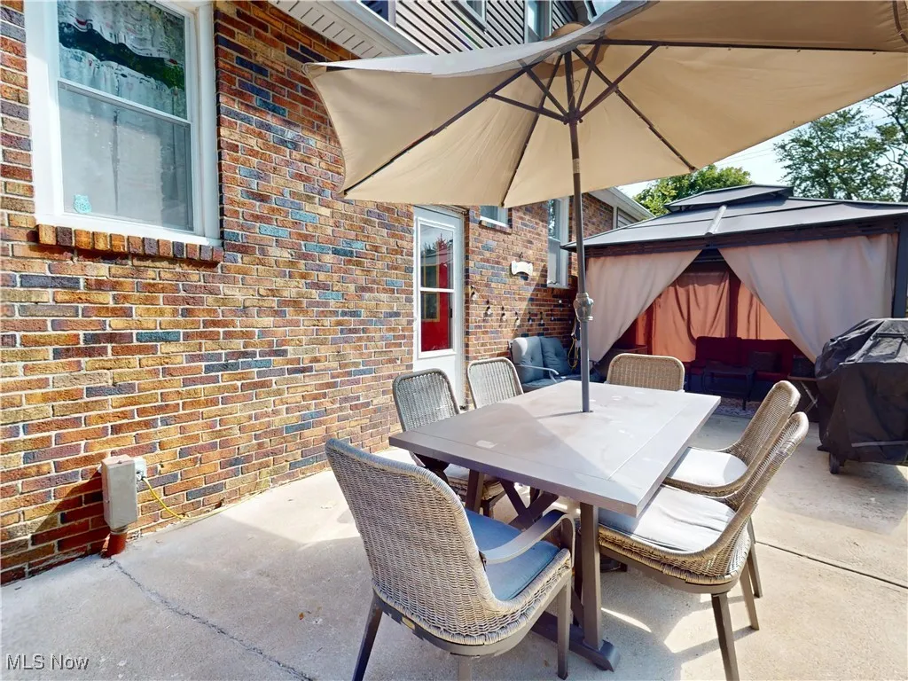 View of patio / terrace featuring outdoor dining space, area for grilling, and a gazebo