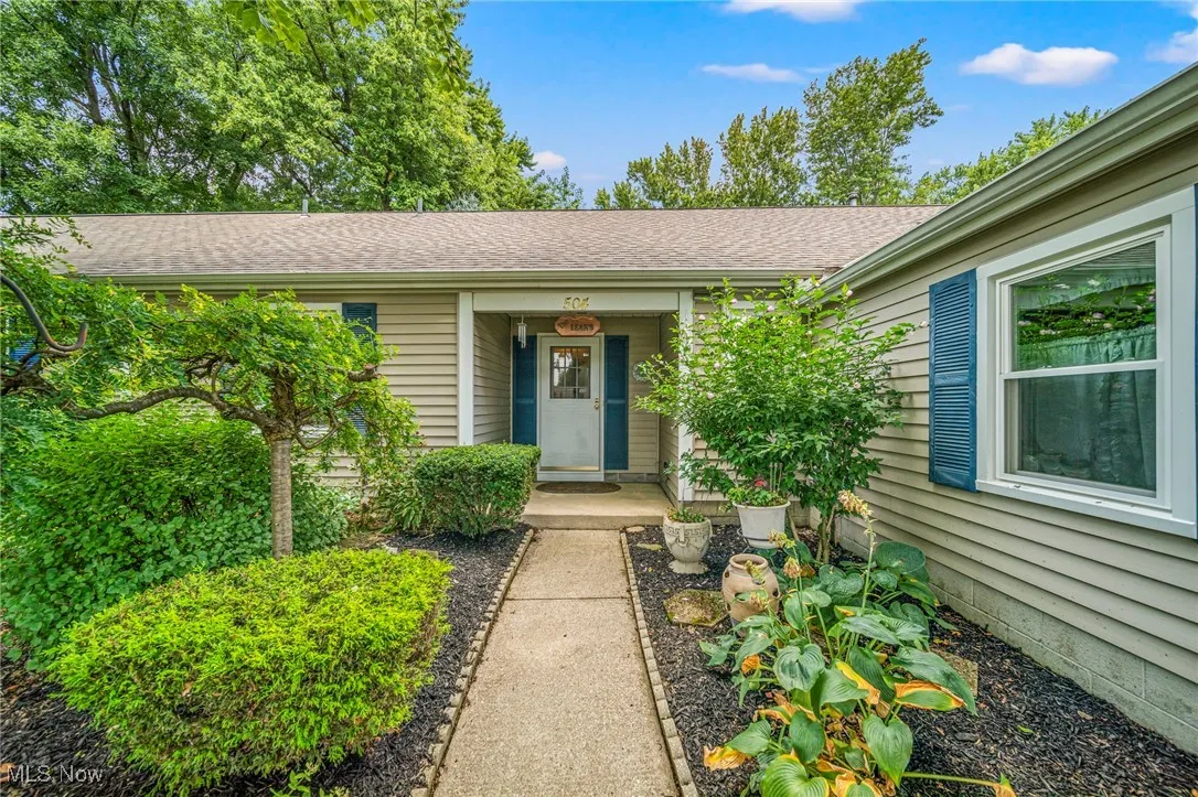 Property entrance with roof with shingles